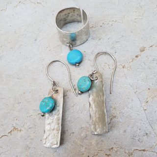 Silver hammered ring with dangling turquoise
