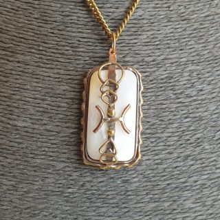 Geometric zodiac sign with mother of pearls