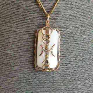 Geometric zodiac sign with mother of pearls