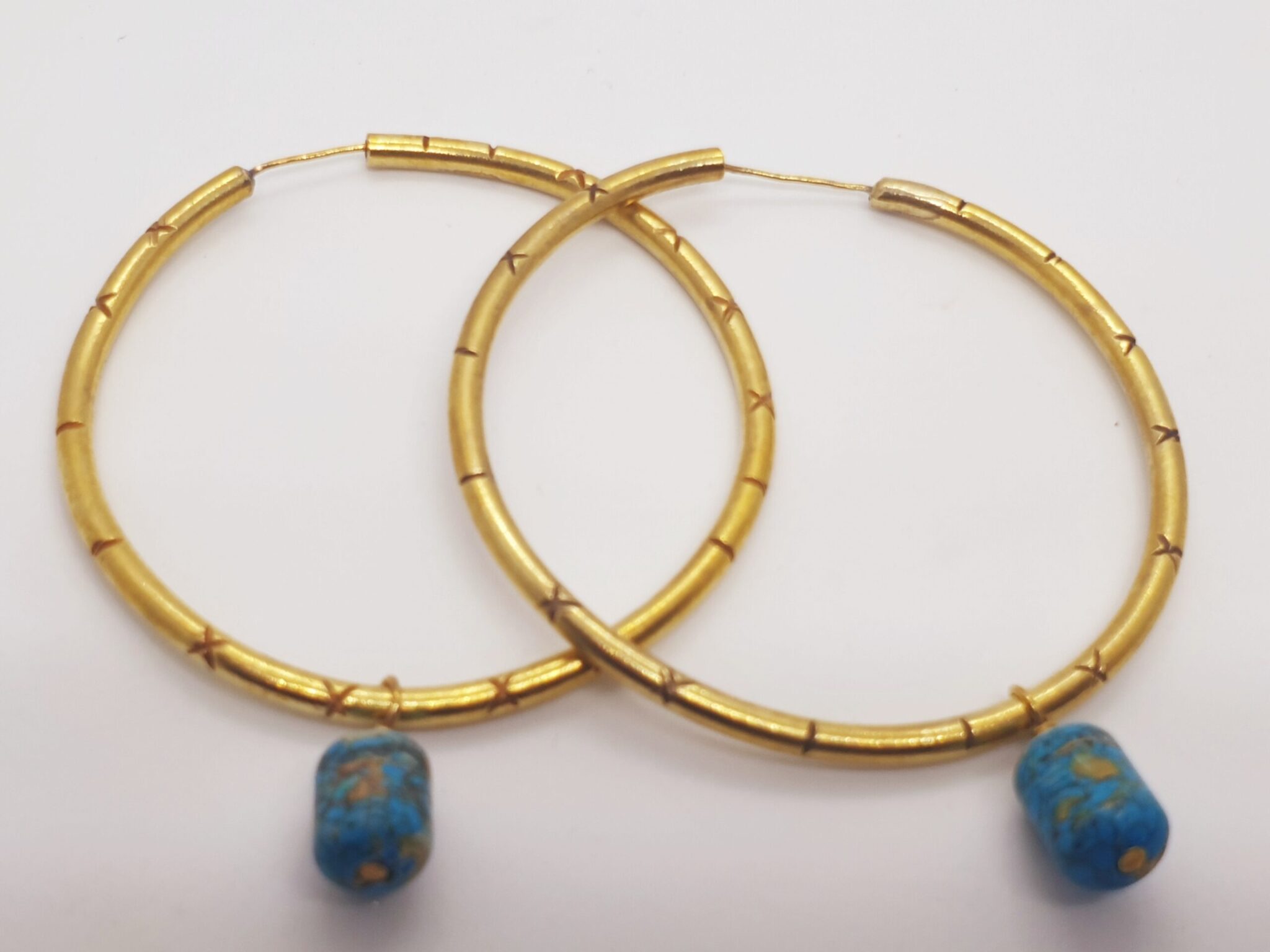 Textured hoop with dangling stone 1 Textured hoop with dangling stone