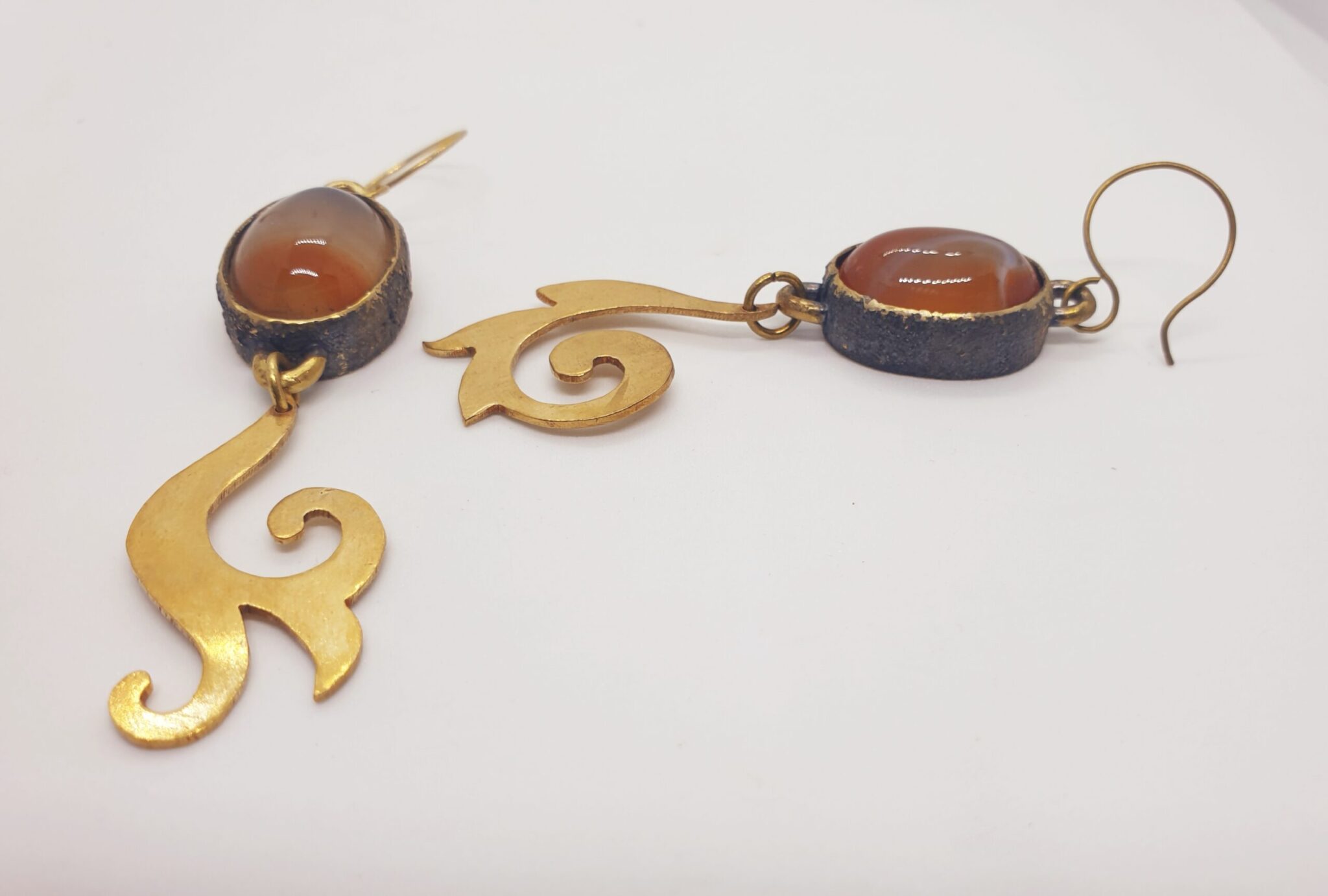 Oval cabochon with copper dust and mismatch dangling design 2 20230309 125224 scaled scaled