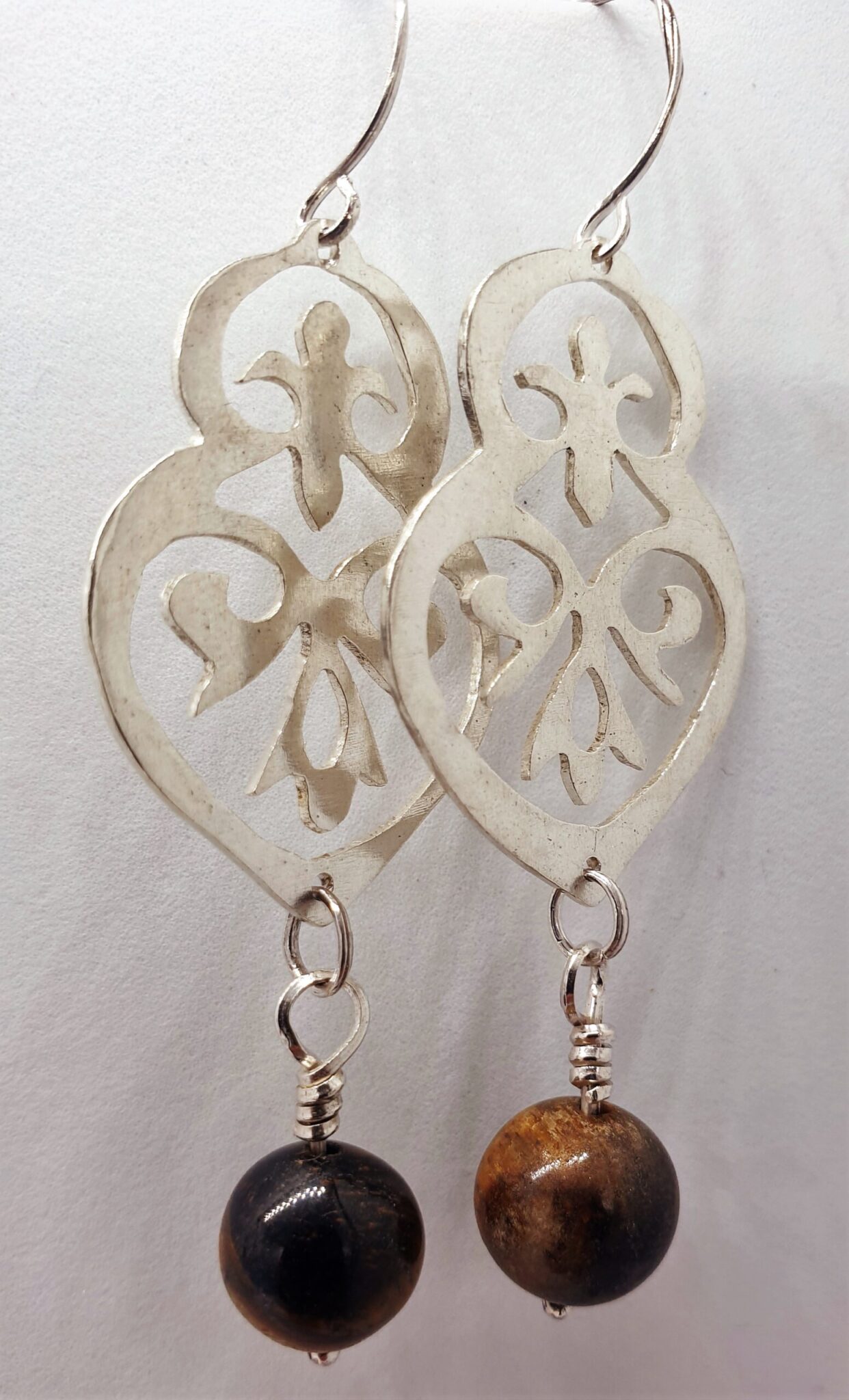 Ornamental silver earring with dangling tiger eye 2 20230309 131354 scaled scaled
