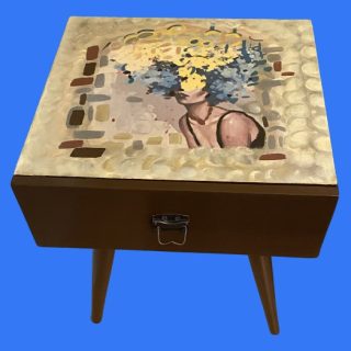 Wooden side table with a drawer