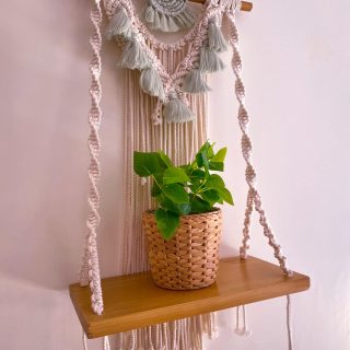 Macrame wall shelf with mint tassels