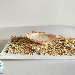 Candle with seashells