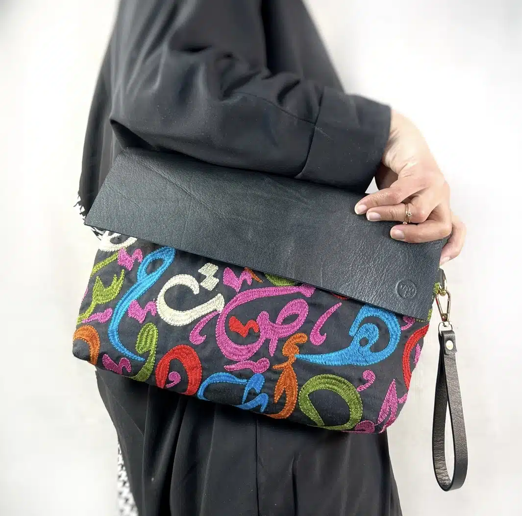 Genuine leather x Fabric Arabic Letters clutch 1 Genuine leather x Fabric Arabic Letters clutch