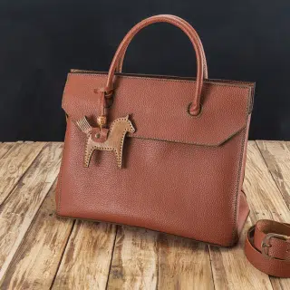 Handbag with horse medal