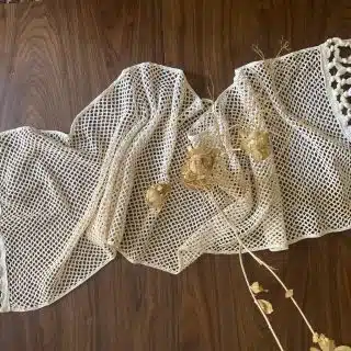 Crochet table runner with tassels