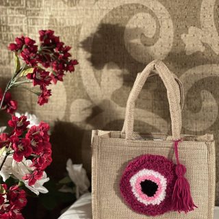 Pink evil eye mini jute bag