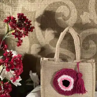 Pink evil eye mini jute bag