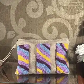 Colored tufted jute clutch