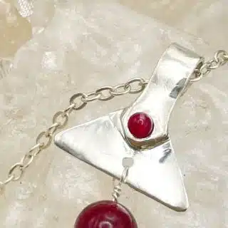 Handmade silver pendant with ruby beads