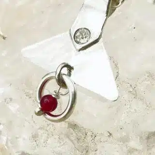 Silver pendant with ruby beads and crystal