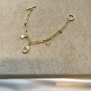 Gold plated bracelet with white Horus eye pendant
