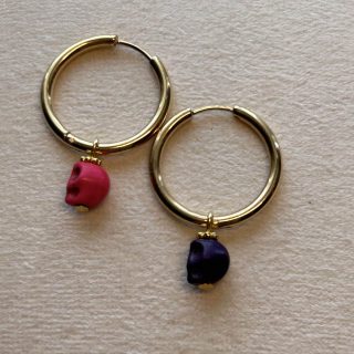 Stainless steel round earrings with skulls medium size