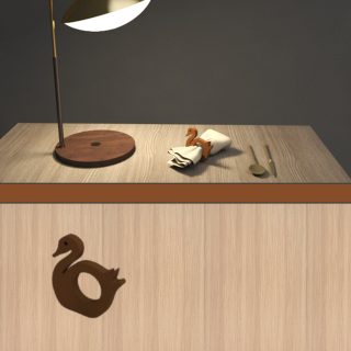 A wooden tissue holder shaped like a duck