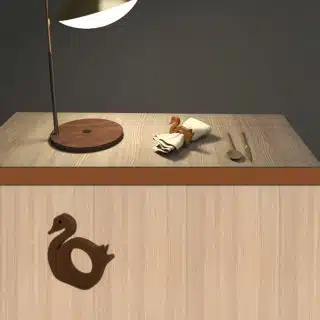 A wooden tissue holder shaped like a duck