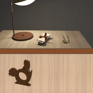 A wooden tissue holder shaped like a bird for restaurants and cafes