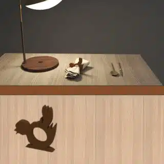 A wooden tissue holder shaped like a bird for restaurants and cafes