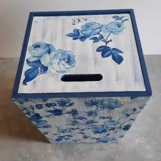 White and blue floral trash bin