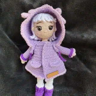 Doll with purple coat