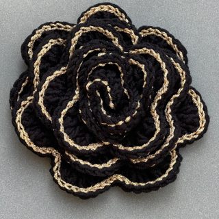 Crochet black rose brooch with golden borders