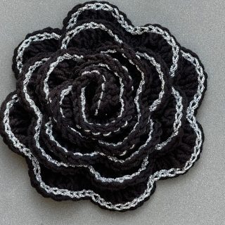 Crochet black rose brooch with silver borders