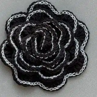 Crochet black rose brooch with silver borders