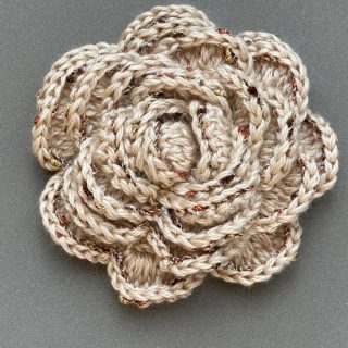 Creamy rose crochet brooch with glittery borders