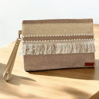 Beige clutch with arabic calligraphy and off white fringes