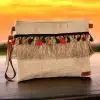 Beige clutch with multicolored fringes and coins