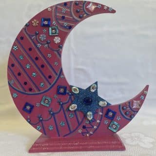 Pink colored wooden crescent