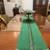 Green fabric table runner