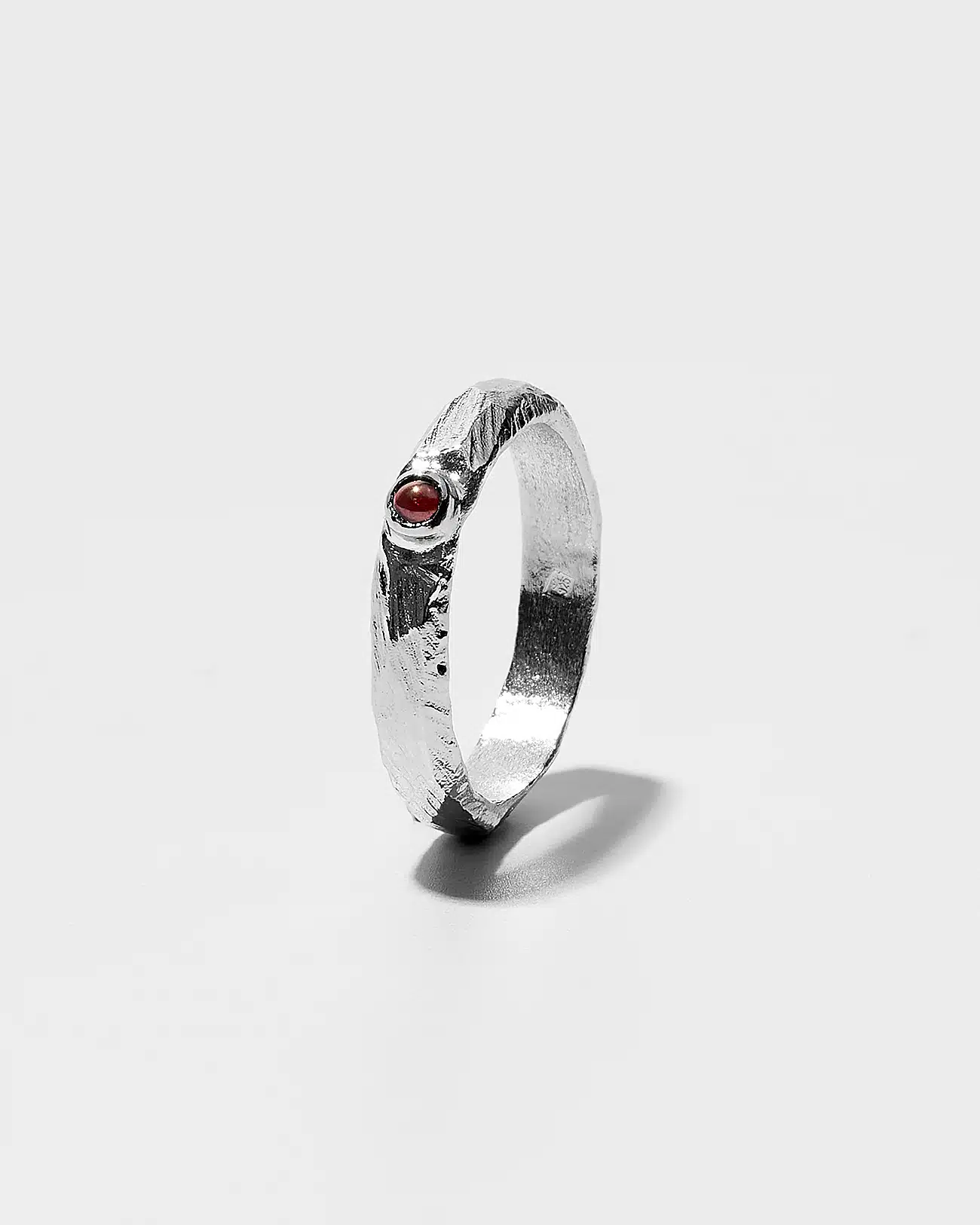 Essential Collection , Organic Textured Band Ring With Small Garnet Stone 1 Essential Collection , Organic Textured Band Ring With Small Garnet Stone