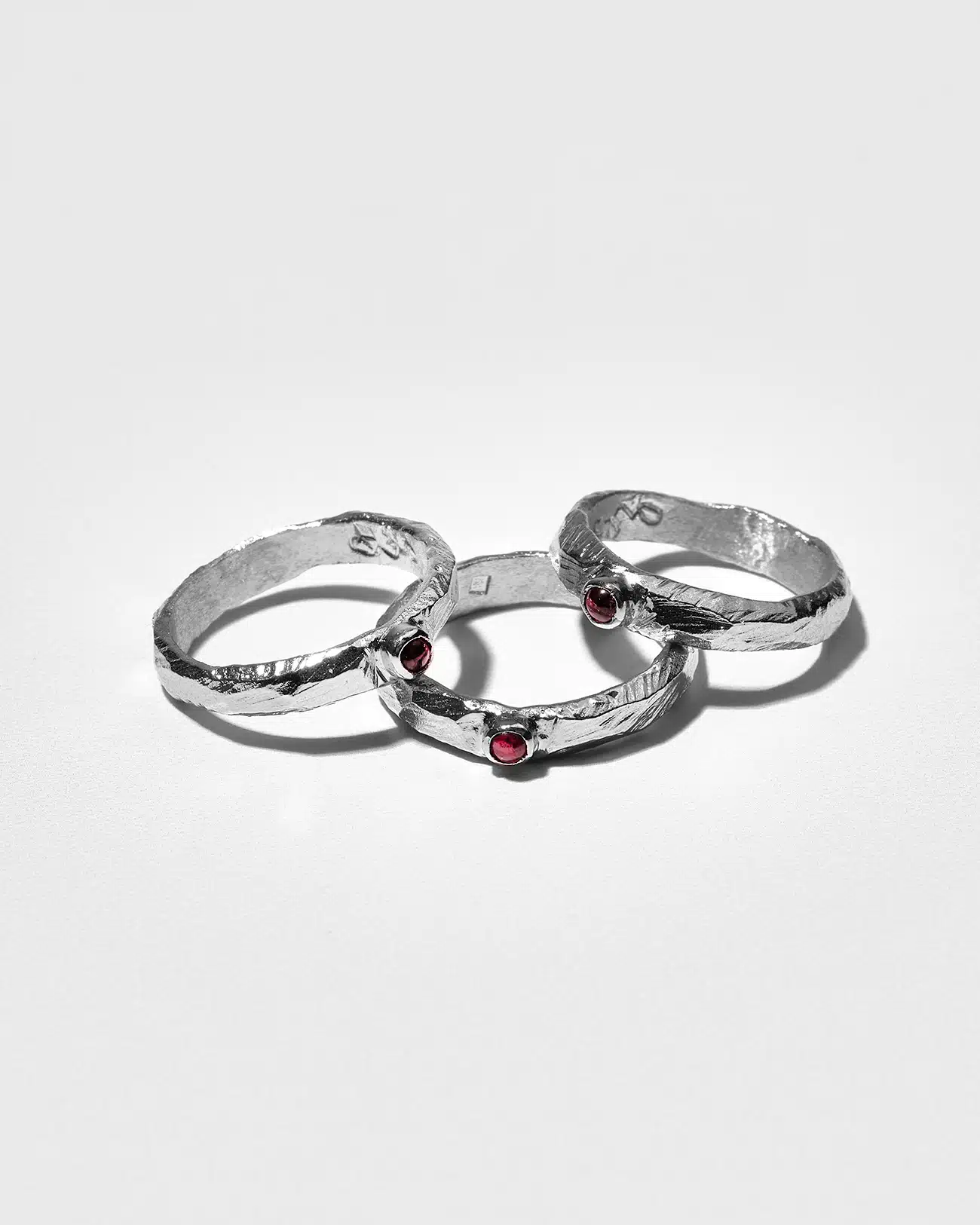 Essential Collection , Organic Textured Band Ring With Small Garnet Stone 4 Organic Textured Ring With Small Garnet Stone SZR231.5