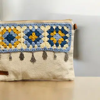 Beige clutch with mustard/blue granny squares