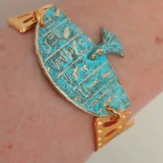 Blue rust pharaoh cuff with goldplated Isis wings on the sides the