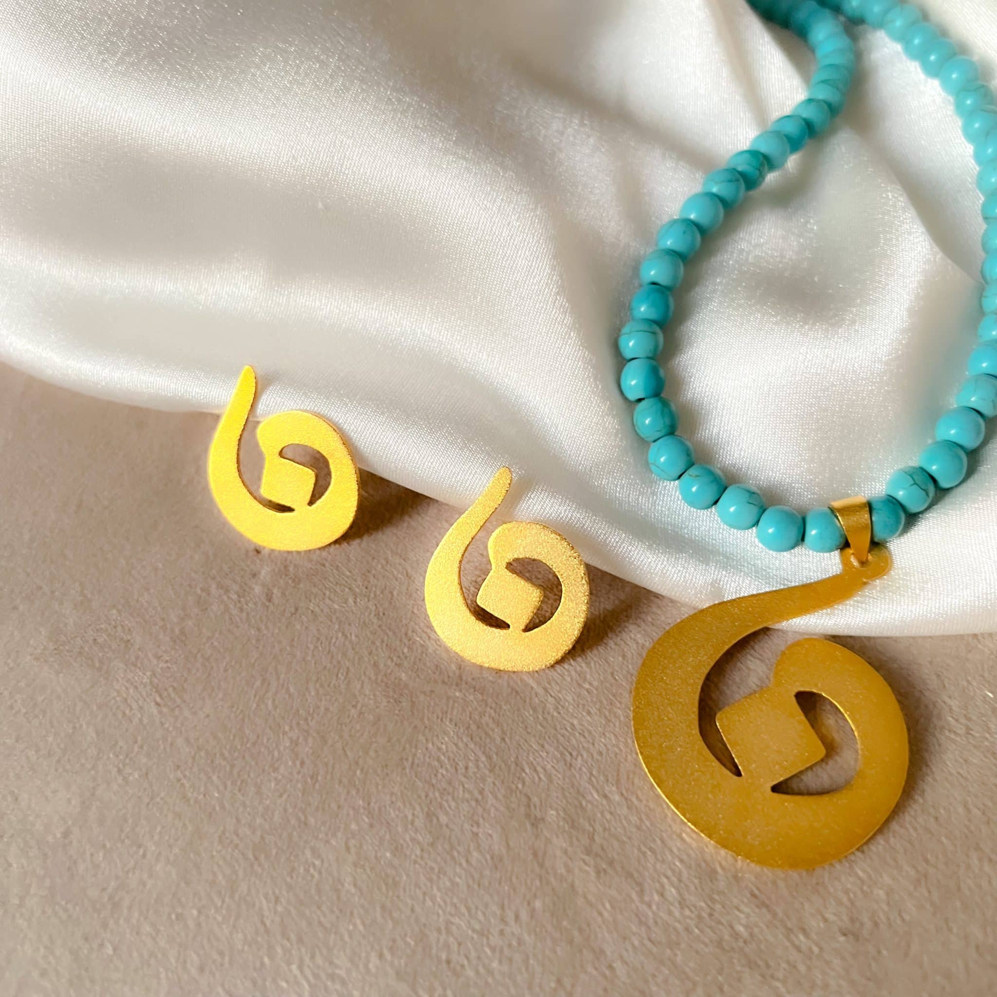 Arabic initial earring 3 D76128D4 9F79 454D B03B A97691D9E406 scaled