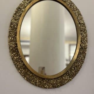 Oval golden mirror