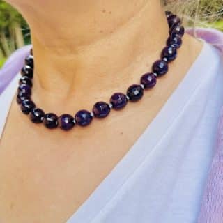 Hand knotted amethyst necklace , sterling silver clasp