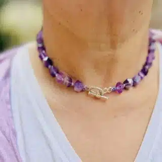 Hand knotted amethyst necklace, sterling silver clasp on the front