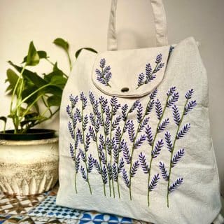 purple flowery Backpack (bag)