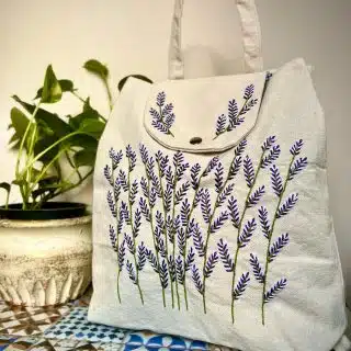 purple flowery Backpack (bag)
