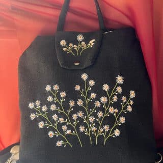 Black flowery Backpack (bag)