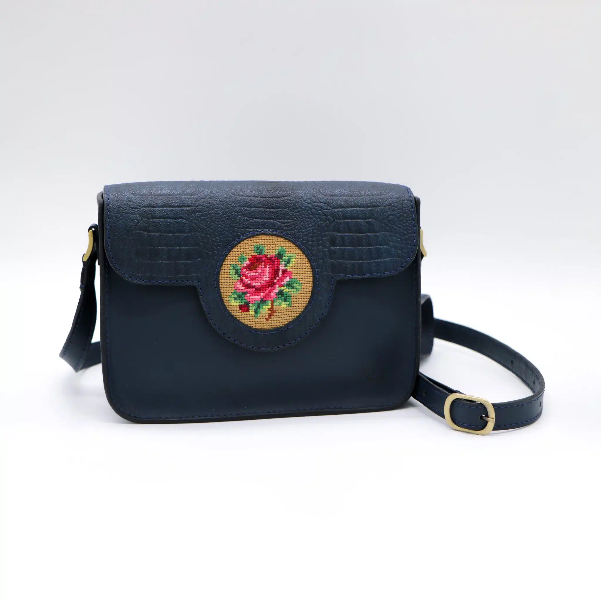 Dark blue genuine leather bag with floral design. 1 Dark blue genuine leather bag with floral design.
