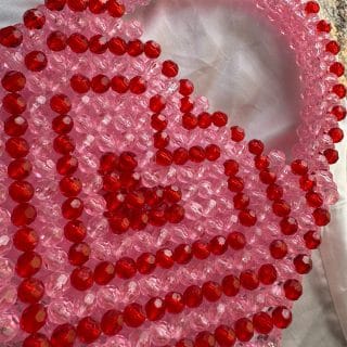 hear beaded bag , in red and pink