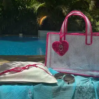 See through white beach bag with pink crochet finish