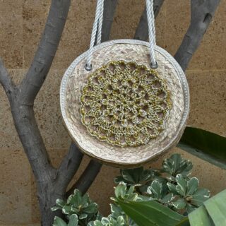Round palm leaves beach bag with golden crochet mandala
