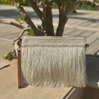 Off white clutch with long tassels